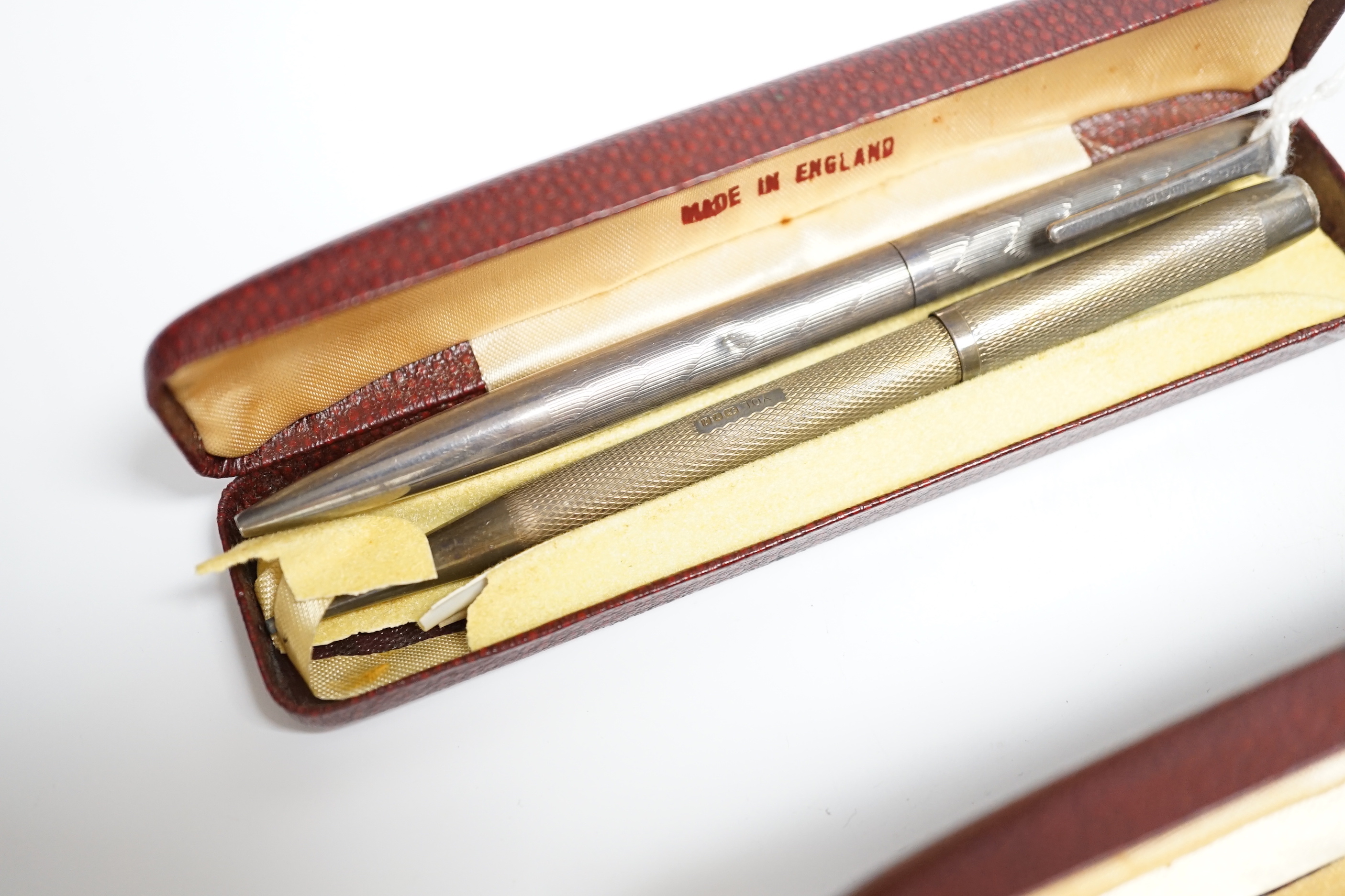 Three Yard O Led silver pencils and two cases